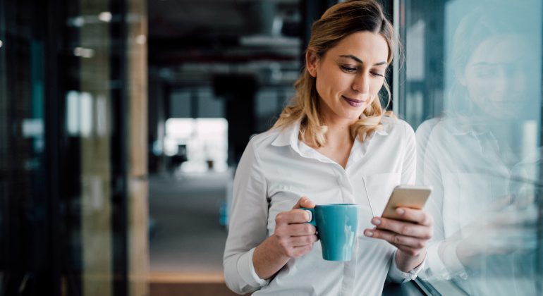 A business women sending a text message