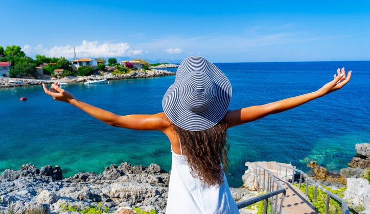 A young lady enjoying a scenic view of Zakynthos Greece during her Europe travel