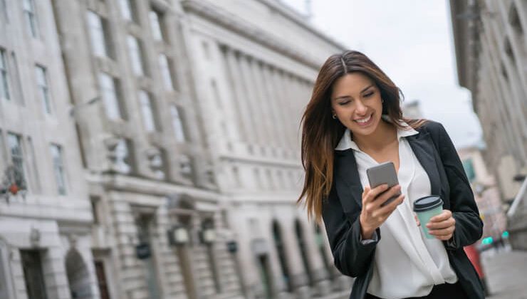 A young girl using iPhone messaging app to send a message abroad