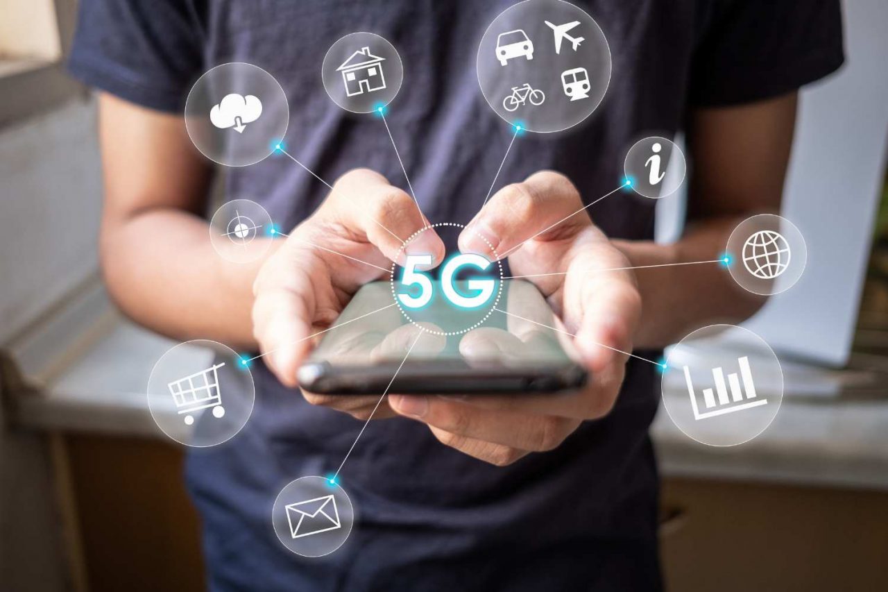 Guy using phone on 5G technology