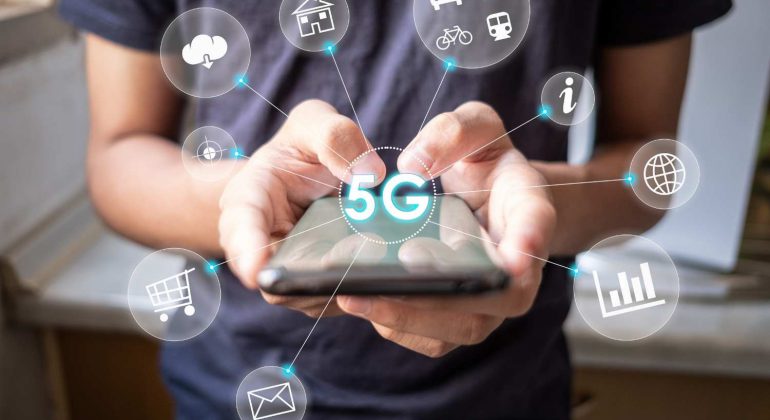 Guy using phone on 5G technology