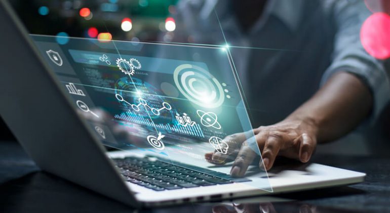 Male programmer using laptop with technology advancement theme