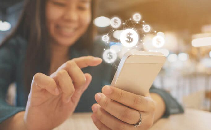 Asian woman hand using mobile phone with online transaction application, Concept financial technology (fin-tech) using money saving app