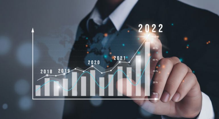 Businessman plan business growth and financial, increase of positive indicators in the year 2022 to increase business growth and an increase for growing up business